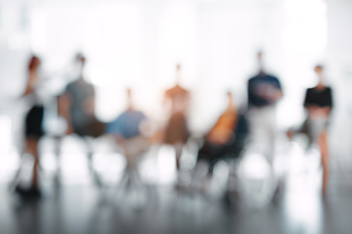 blurred image of a meeting