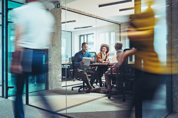 three people in a meeting